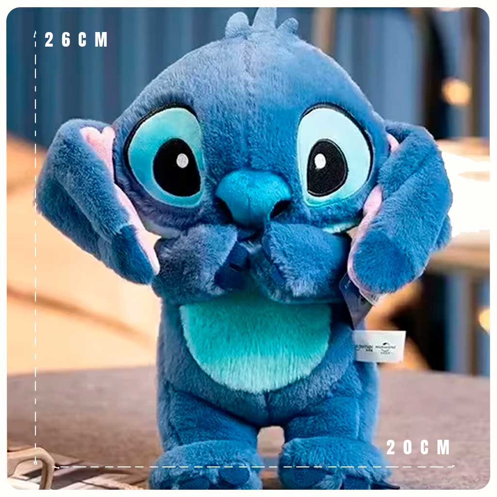 Pelúcia azul do Stitch em pé com 26 cm de altura, olhos grandes e textura macia de pelúcia.