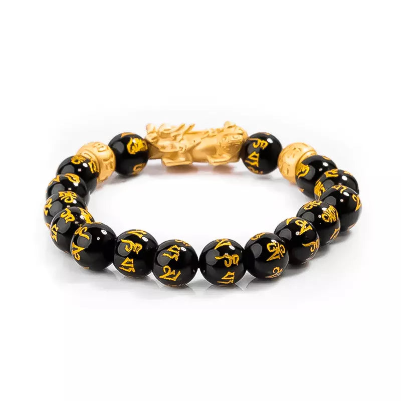 Pulseira da prosperidade Feng Shui com contas de obsidiana negra e charm Pixiu dourado, simbolizando proteção, sorte e riqueza - Pelicano Azul